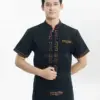 Trước đồng phục phục vụ nhà hàng TTNHAPVM21 màu đen phối cam
